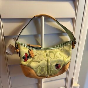 Rare coach lady bug purse with Swarovski crystals. New with tags